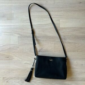 Kate spade black leather cross body with tassel and gold details